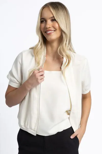 Add a bit of fun layer to your everyday look with this Harper Jacket. In a Cupro viscose blend, the crop jacket with a zip front has short sleeves and easy vibes. Style it over tanks and tees with minimal fuss. Style HS25212.
