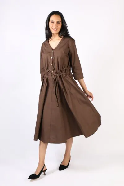 Step out in style with this illium circle dress. In a solid color, this dress with button front, v neck and cinches your waist perfectly. Hugging you in all the right places, it has 3/4 sleeves and side pockets and falls at a perfect tea length. Style thi
