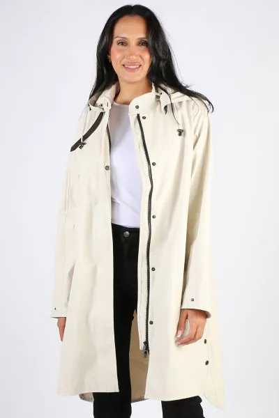Image of a knee-length, black Ilse Jacobsen raincoat made from waterproof fabric. The coat features a front zip and button closure, a drawstring hood, and two large pockets at the hips. The coat has a flattering A-line shape and is ideal for keeping dry i
