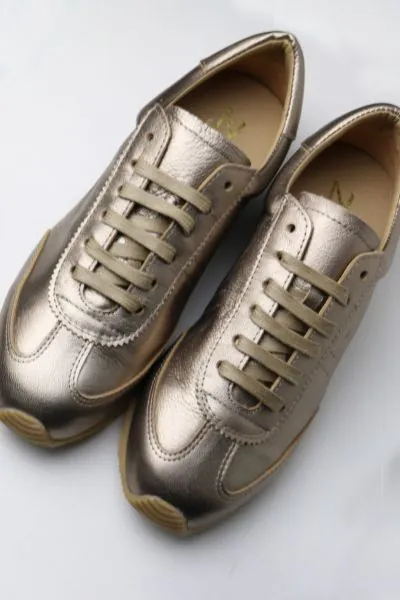 Go for a more than your average basic sneaker this season by Zeta. The Innox Sneaker is a fun sneaker in a metallic finish leather upper and a lace up closure. The flexi sole provides easy comfort Go for your favourite colour this season.