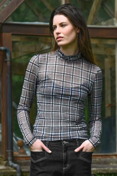 Lightweight and made for layering, the IT IS NECK AND NECK Top is a sleek foundation piece with a modern edge. Crafted in CHECK AND CHECK AGAIN soft printed mesh fabric, this close fit silhouette features a clean turtle neck, making it perfect for buildin