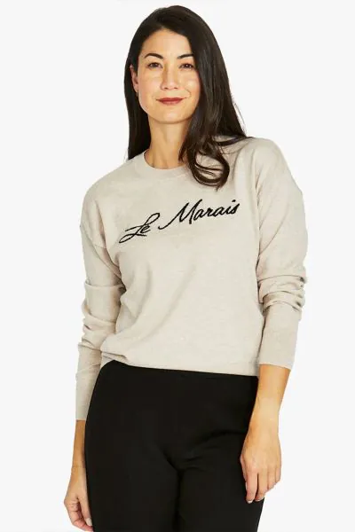Introducing the Le Marais Pullover, perfect for layering or solo wear. The Le Marais Pullover offers a classic yet contemporary look with its simple design, comfortable fit and chic intarsia knit text. The silhouette is relaxed, providing ease of movement