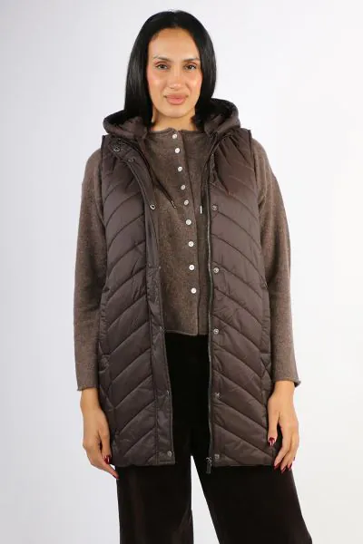 Introducing the Longline Vest, the versatile piece of outwear you will be reaching for this season. Detachable hood with grosgrain tie, Concealed front zip with snap button closure , Lightweight, Side zips. Its longline shape is perfect for when you are o