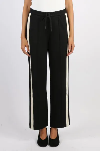 The Century Pant offers a relaxed wide leg fit with an elasticated waistband and drawcord for comfort. Featuring cream herringbone tape along the side seams and a pin tuck stitch down the centre leg, this versatile style blends ease with effortless sophis