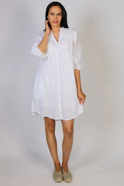 Go for a cool summer black dress this season in this Shayna Dress by Lula Life. In a crush cotton, the dress has lace details, along with a round neck and button front . With gathered sleeves and a waist tie to cinch it in all the right places and pockets