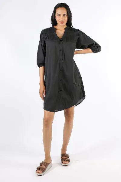 Go for a cool summer black dress this season in this Shayna Dress by Lula Life. In a crush cotton, the dress has lace details, along with a round neck and button front . With gathered sleeves and a waist tie to cinch it in all the right places and pockets