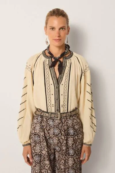 An effortlessly charming shirt by Maison Hotel is a perfect go to for the season. The Ringo Shirt in Crinkle Cotton features an overall striking embroidery and front open neck with front button and full sleeves. Style with easy wide leg pants for an easy 
