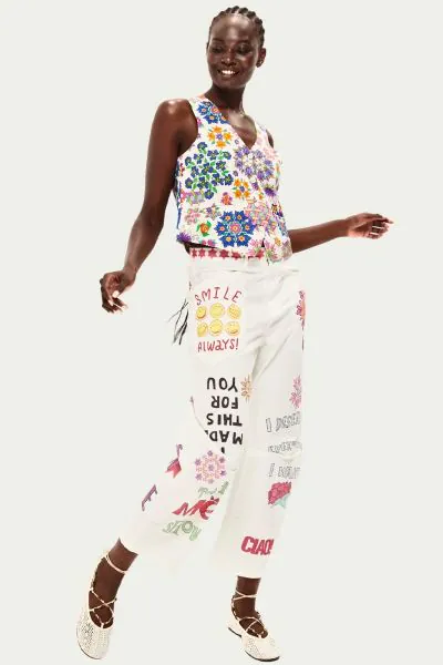 Celebrate yourself with the Gala pants featuring empowering statements like SMILE ALWAYS, Ill FOCUS ON WHAT MAKES ME HAPPY, positive, and ME scattered across crisp white cotton. Handpainted flowers, geometric stars, and playful icons including CIAO create