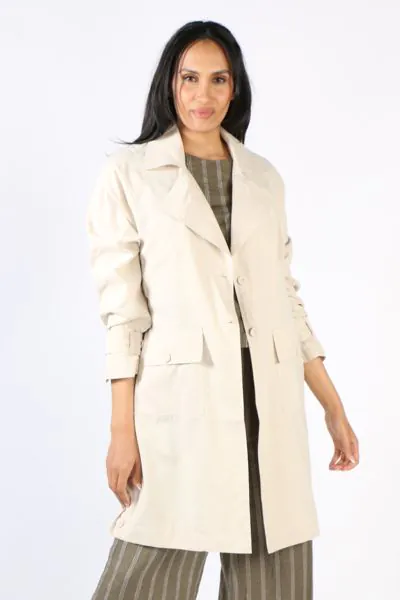 Layer up in style with this coat jacket by Ping Pong. In 100% Sanded Tencel, the edge to edge trench coat style jacket had full tab sleeves and double front ppckets. Style it over a dress or separates. Style P555402.