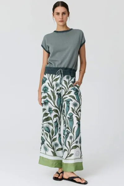 Got for the POL Linne Pant this season. A wide leg trouser featuring a unique botanical print illustration of carnivorous plants, including Venus flytraps and pitcher plants. These pants are designed with a high rise waist, clean front buttons, and a thic