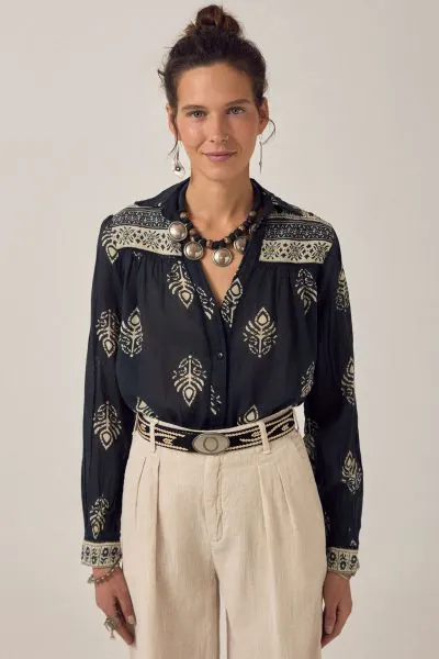 Long sleeve shirt in lightweight cotton. Collared, button down front, button cuffs. Cut from the signature shirt pattern soft, breathable, falls naturally on the body. Easy structure, familiar fit. Deep black base with henna inspired print. Floral forms a