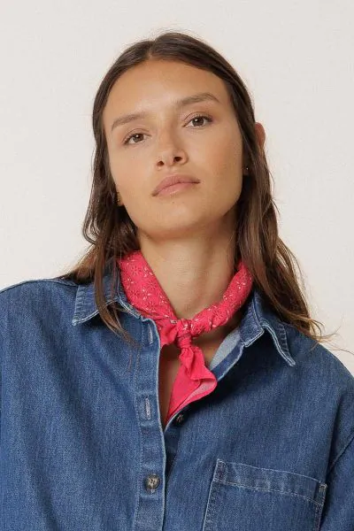 This scarf will elevate all your looks. It is made from organic cotton and features a block print with a floral border. RG657.
