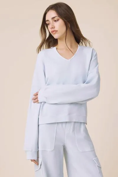 A modern take on a cozy essential, this Splendid Alessia Pullover features a relaxed silhouette with a clean split neckline and long sleeves for an elevated feel. Designed in a smooth, lightweight fabric with dropped shoulders, straight hem and subtle dra