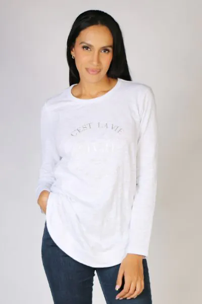 An easy white shirt gets an upgrade by Threadz. With a silver print print, has a round neck, long sleeves and a rounded hem. Style it with easy denims and sneakers for an easy look. Style 42656.
