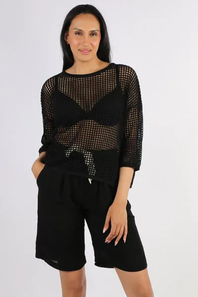 The easy Two by Two top is your easy summer layering Rebe top. In an open weave, the top has round neck and 3/4 sleeves. Layer up over easy tanks. Style X31.
