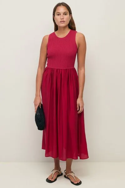 Effortlessly elegant, our Maxi Dress features a fitted ribbed knit bodice that beautifully shapes and flatters the silhouette, flowing into a floaty, airy skirt that moves with grace. This combination of structure and softness creates a versatile, feminin