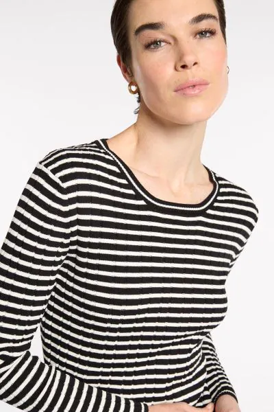 The Fine Stripe Rib Knit blends style and comfort with its round neckline and long sleeves. Elevated with varied fine ribs, adding texture and depth to the overall look while remaining comfortable with it's built in stretch. This essential piece is a must