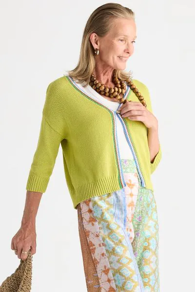 Introducing a charming crochet trim cardigan, perfect for adding a touch of elegance to your wardrobe. This cosy piece features stylish 3/4 sleeves and a self fastening design for a snug fit. The eye catching contrast crochet trim adds a delightful detail