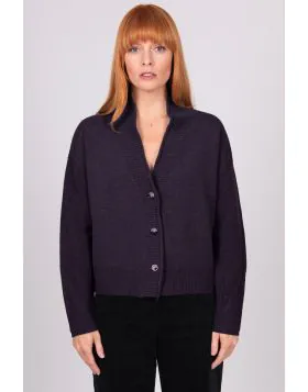 A Boxy fit relaxed cardigan with ribbed shawl collar and detailed, cable panel feature. Dropped shoulders for an easy to wear, relaxed look. High hip length. The collar can be worn high or folded for a roll collar effect. Horn-look buttons for a stylish f
