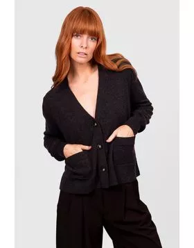 Elevate your layering wardrobe with the V Neck Relaxed Cropped Cardigan, a chic fusion of modern simplicity and cozy comfort. Crafted to be effortlessly versatile, this cardigan features a flattering cropped length and relaxed fit that pairs seamlessly wi
