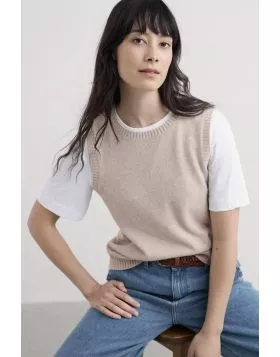 The simplest pieces of clothing can often tie whole outfits together. With a neat shape and ribbed edges, the East View Vest is made from soft, lightweight merino rich yarn, and will layer over everything for an instant, modern update. We love it over dre