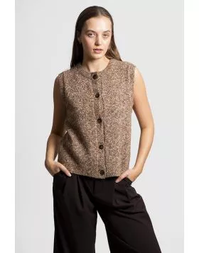The Button Up Vest offers a fresh take on classic knitwear, merging playful texture with everyday ease and layered charm. It is a must have piece for adding dimension, creativity and warmth to your wardrobe. Crafted from a distinctive nep yarn blend, it c