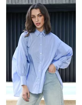 The Living the Dream shirt brings a fresh, edgy twist to casual dressing. With its effortless relaxed silhouette and contemporary high low hem, it flows with movement and attitude, perfect for layering or wearing solo. Featuring batwing, gathered sleeves,