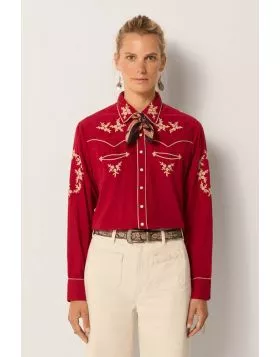 Turn heads for all the right reasons this season in this Western inspired shirt by Maison Hotel. In cotton, the shirt has embroidered motifs, along with button up front, long sleeves and easy and luxe vibes. Cut from cotton and inspired by Western classic