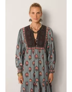 A dress that is bound to get you compliments, this Allegra dress does just that. The dress in a rich hand block printed textile in water lillies motifs all over, has a contrast panel, full sleeves with gathered details and the maxi length that sashays wit