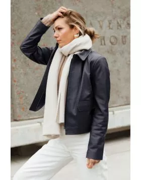 A clean cut leather jacket with a softly structured shape that feels polished without being overdone. The rich hazelnut tone adds warmth, while the minimal design keeps it timeless and easy to wear. Fitted through the shoulders with a relaxed finish throu