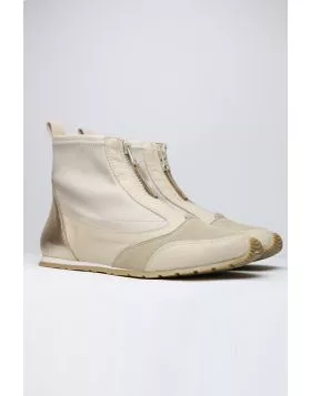 Sleek and sophisticated, this Istra Sneaker Boot by Zeta is a perfect go to for the season. The soft wedge boot has a front zip top in a combination of nylon and leather. Style this Sneaker boot with separates or add an edge to your dresses. 