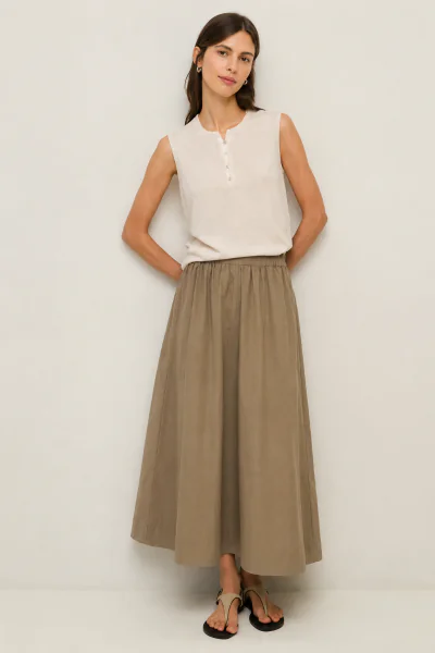 The Yerse Poplin Skirt is an effortless summer staple with a clean, timeless silhouette. Crafted from crisp, lightweight poplin, it features a softly gathered elasticated waistband that sits comfortably on the waist and falls into a relaxed midi length. T